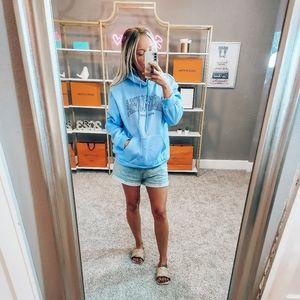 Light blue drawstring graphic sweatshirt with pockets size small NWOT